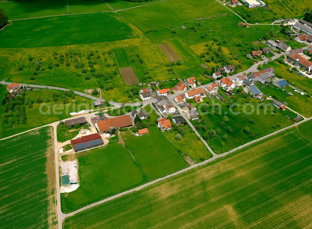 Amstetten from the bird's eye view: Agricultural land and field boundaries surround the settlement area of the village in Amstetten in the state Baden-Wuerttemberg, Germany