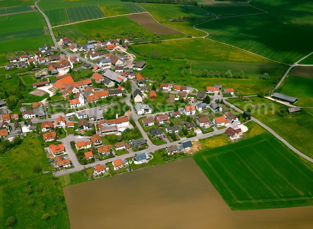 Amstetten from the bird's eye view: Agricultural land and field boundaries surround the settlement area of the village in Amstetten in the state Baden-Wuerttemberg, Germany