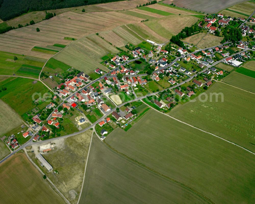 Aerial photograph Anbau - Agricultural land and field boundaries surround the settlement area of the village in Anbau in the state Saxony, Germany