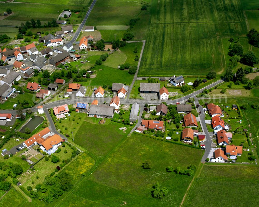 Aerial image Appenrod - Agricultural land and field boundaries surround the settlement area of the village in Appenrod in the state Hesse, Germany