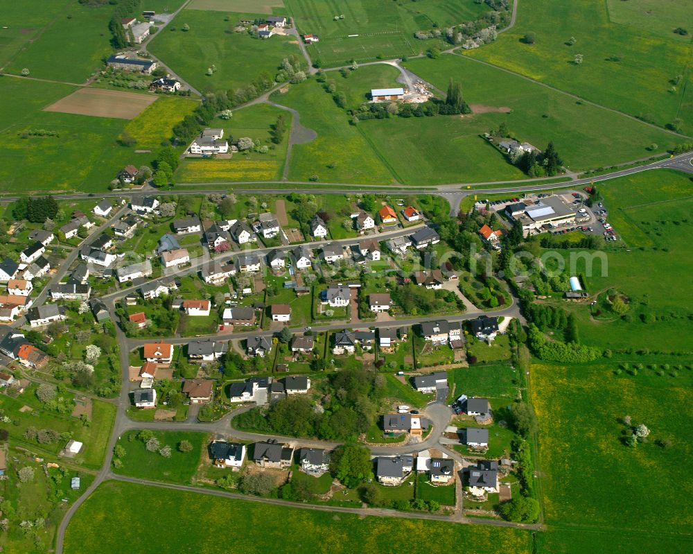 Aerial photograph Arborn - Agricultural land and field boundaries surround the settlement area of the village in Arborn in the state Hesse, Germany