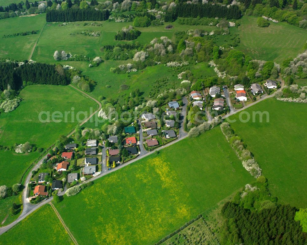 Aerial image Arborn - Agricultural land and field boundaries surround the settlement area of the village in Arborn in the state Hesse, Germany