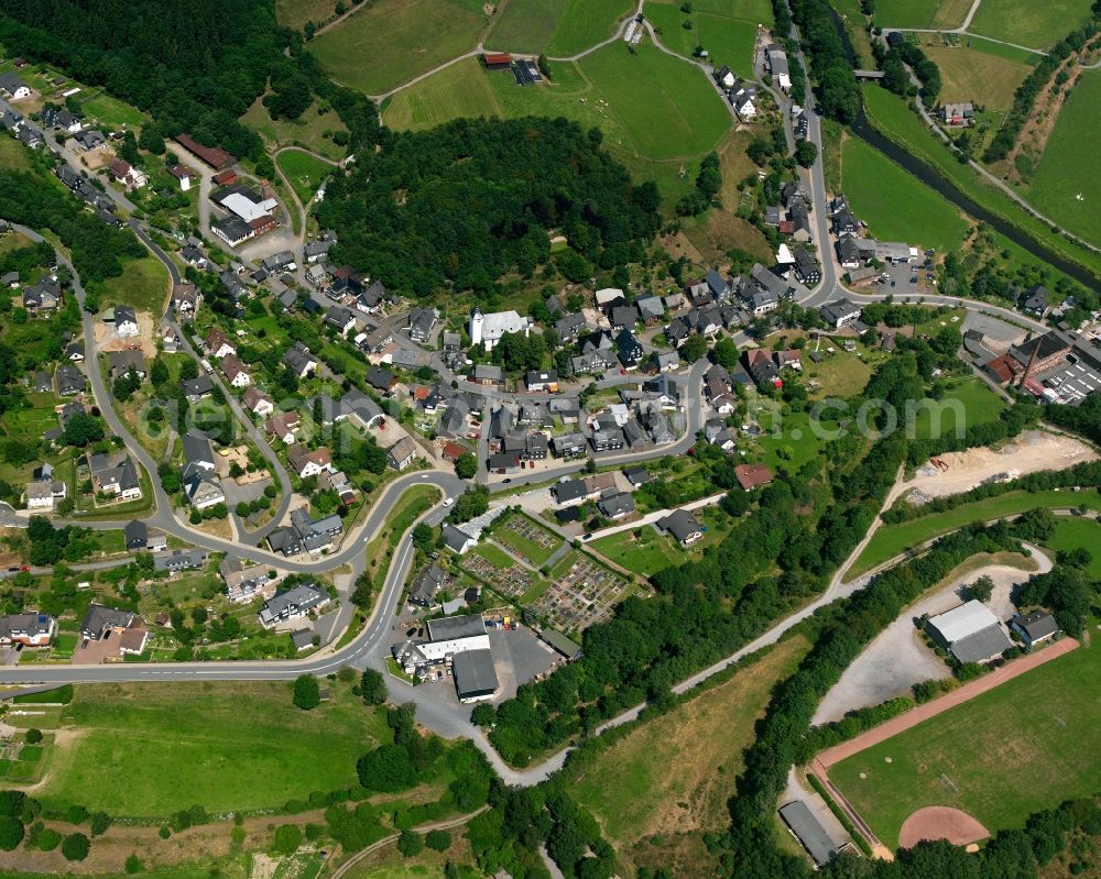 Arfeld from above - Agricultural land and field boundaries surround the settlement area of the village in Arfeld in the state North Rhine-Westphalia, Germany