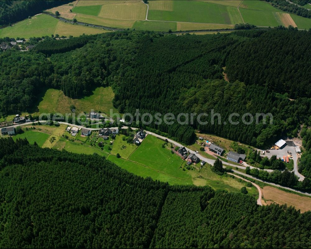 Aerial image Arfeld - Agricultural land and field boundaries surround the settlement area of the village in Arfeld in the state North Rhine-Westphalia, Germany