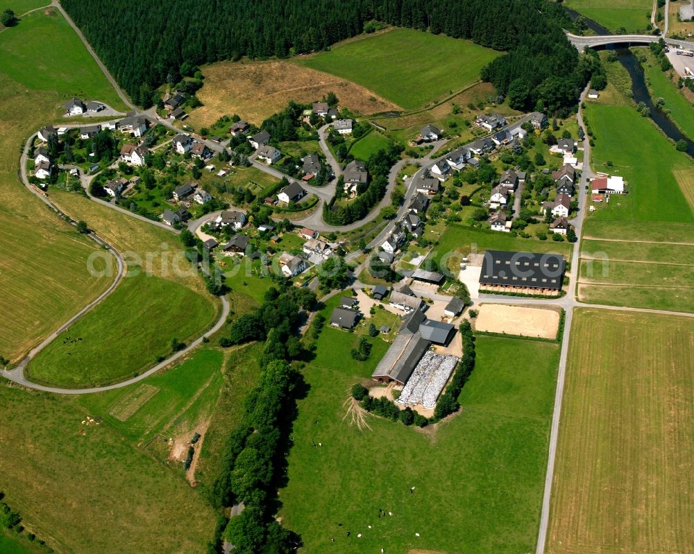 Arfeld from the bird's eye view: Agricultural land and field boundaries surround the settlement area of the village in Arfeld in the state North Rhine-Westphalia, Germany