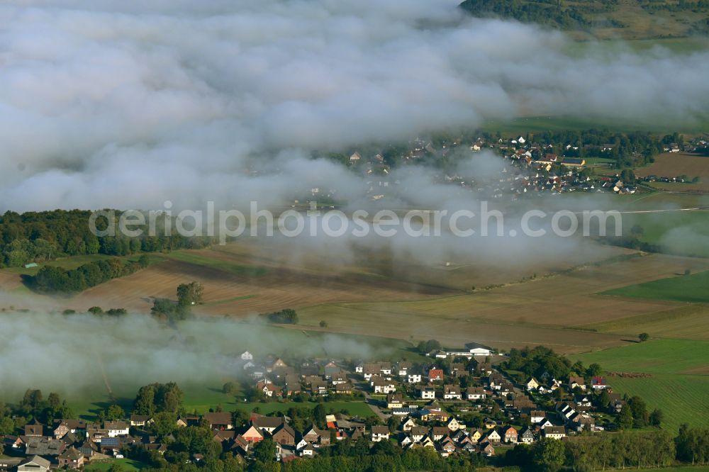 Aerial image Arholzen - Agricultural land and field boundaries surround the settlement area of the village on street Hauptstrasse in Arholzen in the state Lower Saxony, Germany