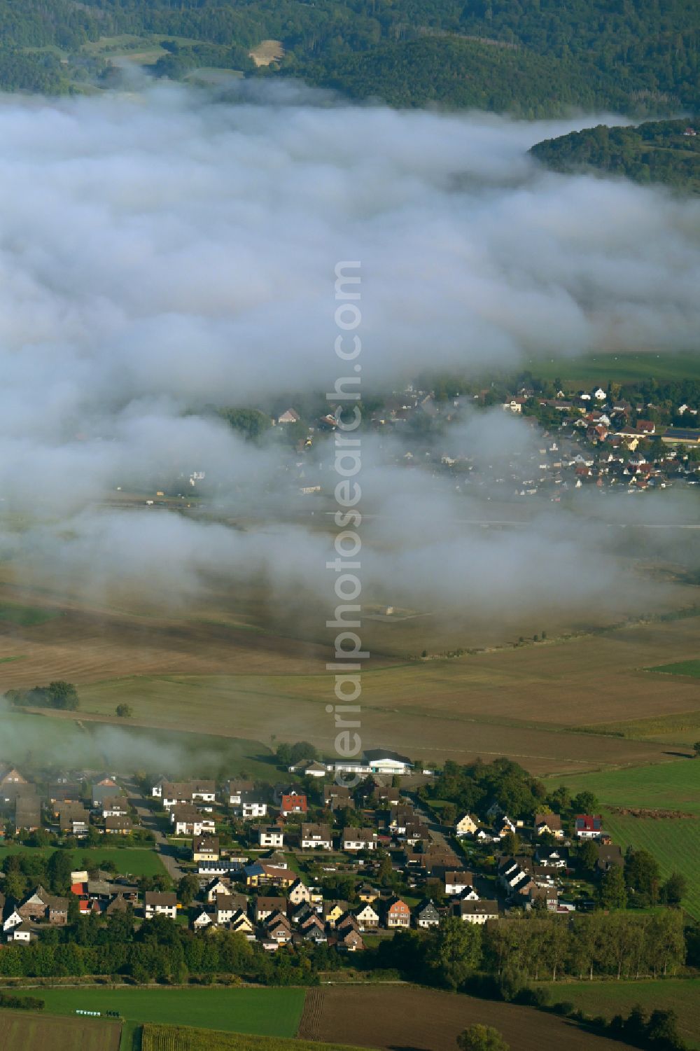 Aerial photograph Arholzen - Agricultural land and field boundaries surround the settlement area of the village on street Hauptstrasse in Arholzen in the state Lower Saxony, Germany