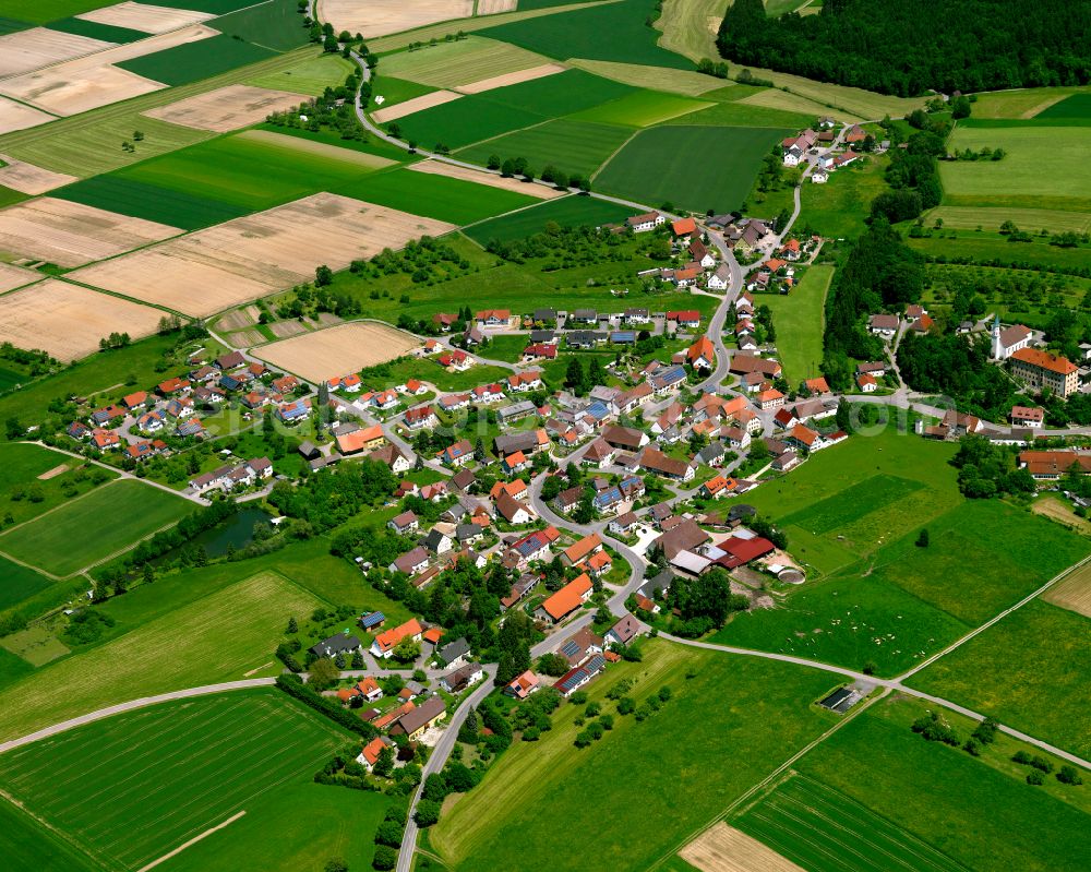 Attenweiler from above - Agricultural land and field boundaries surround the settlement area of the village in Attenweiler in the state Baden-Wuerttemberg, Germany