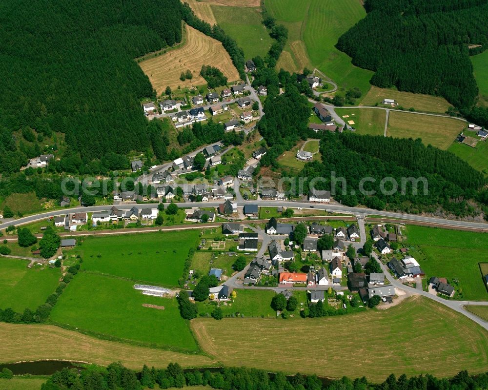 Aue from the bird's eye view: Agricultural land and field boundaries surround the settlement area of the village in Aue in the state North Rhine-Westphalia, Germany