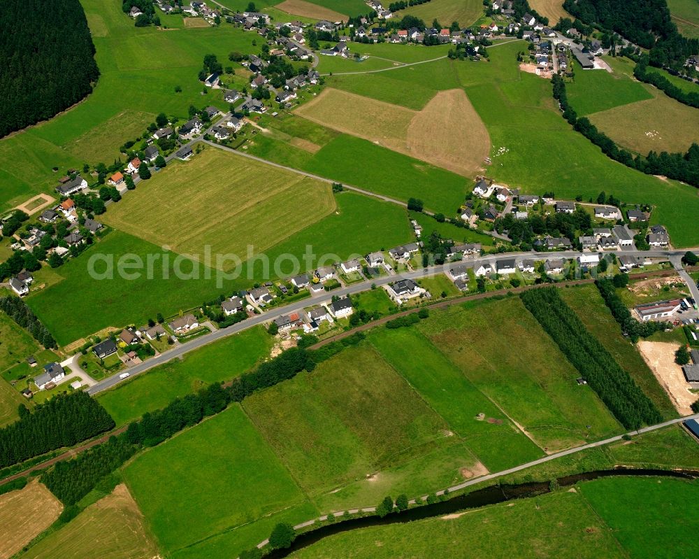 Aerial image Aue - Agricultural land and field boundaries surround the settlement area of the village in Aue in the state North Rhine-Westphalia, Germany