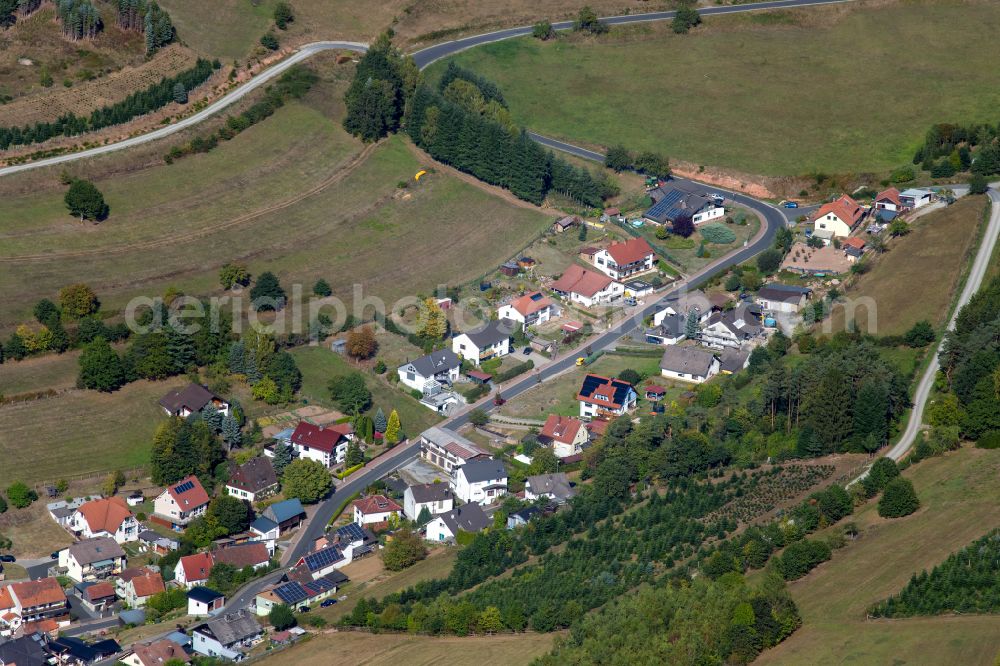 Aura im Sinngrund from the bird's eye view: Agricultural land and field boundaries surround the settlement area of the village in Aura im Sinngrund in the state Bavaria, Germany