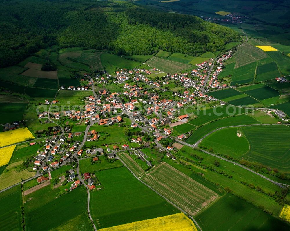 Aerial image Ausbach - Agricultural land and field boundaries surround the settlement area of the village in Ausbach in the state Hesse, Germany