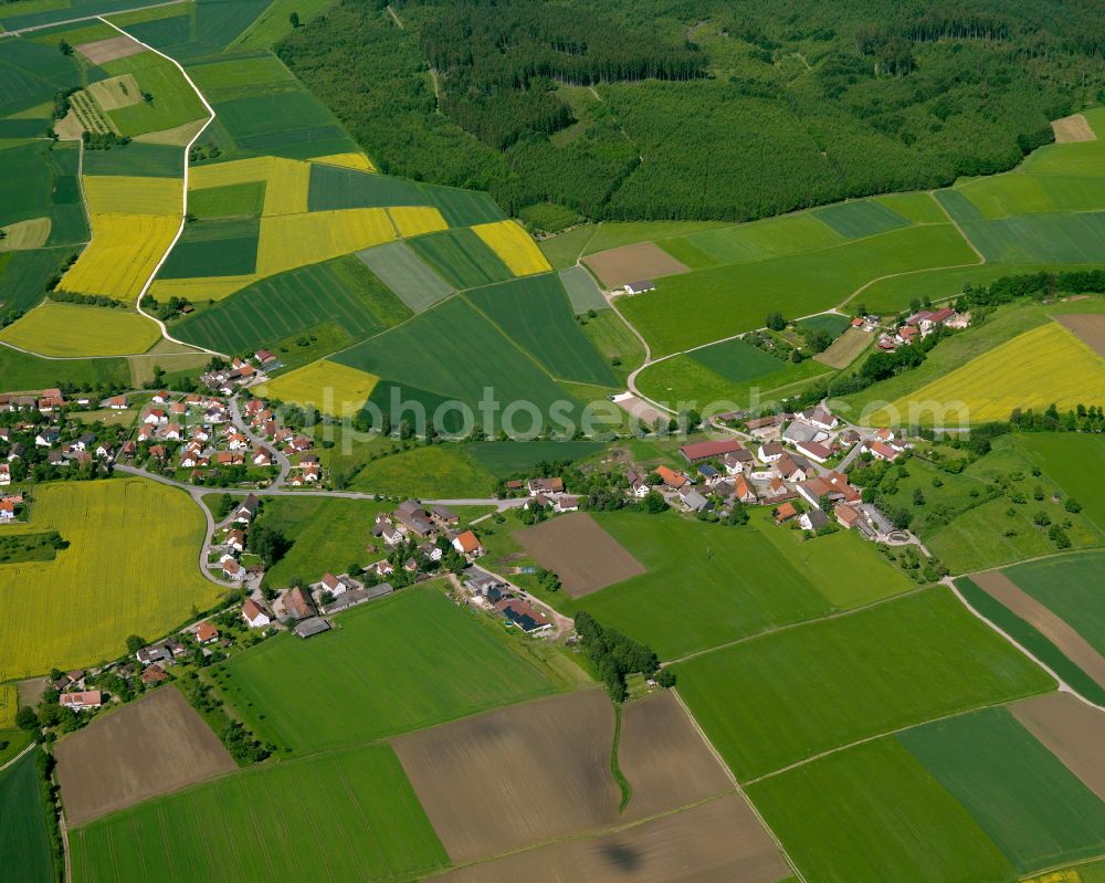 Auttagershofen from the bird's eye view: Agricultural land and field boundaries surround the settlement area of the village in Auttagershofen in the state Baden-Wuerttemberg, Germany