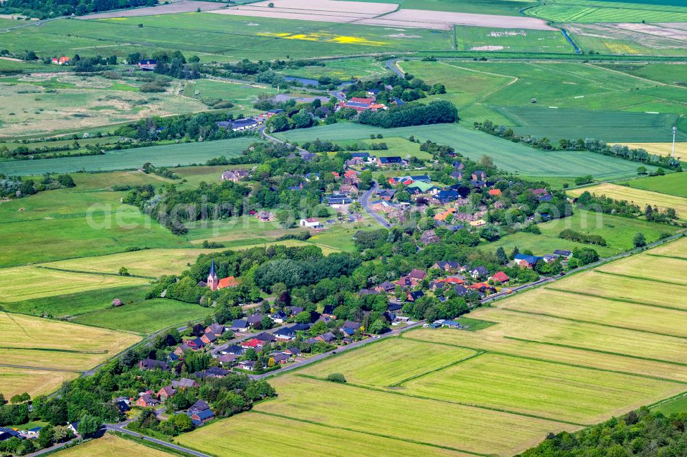 Aventoft from above - Agricultural land and field boundaries surround the settlement area of the village in Aventoft in the state Schleswig-Holstein, Germany