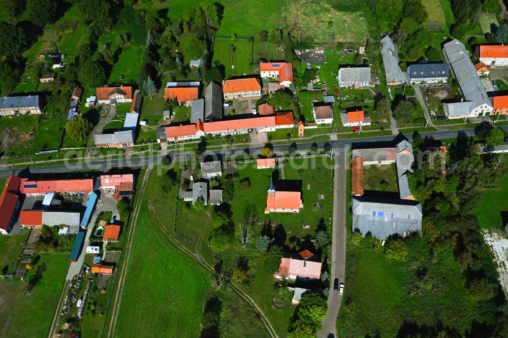 Baars from above - Agricultural land and field boundaries surround the settlement area of the village in Baars in the state Saxony-Anhalt, Germany