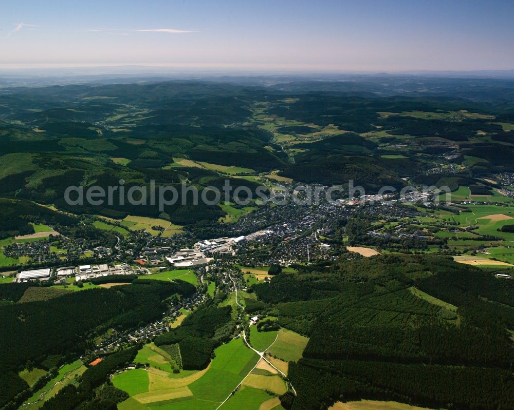 Aerial photograph Bad Berleburg - Agricultural land and field boundaries surround the settlement area of the village in Bad Berleburg at Siegerland in the state North Rhine-Westphalia, Germany