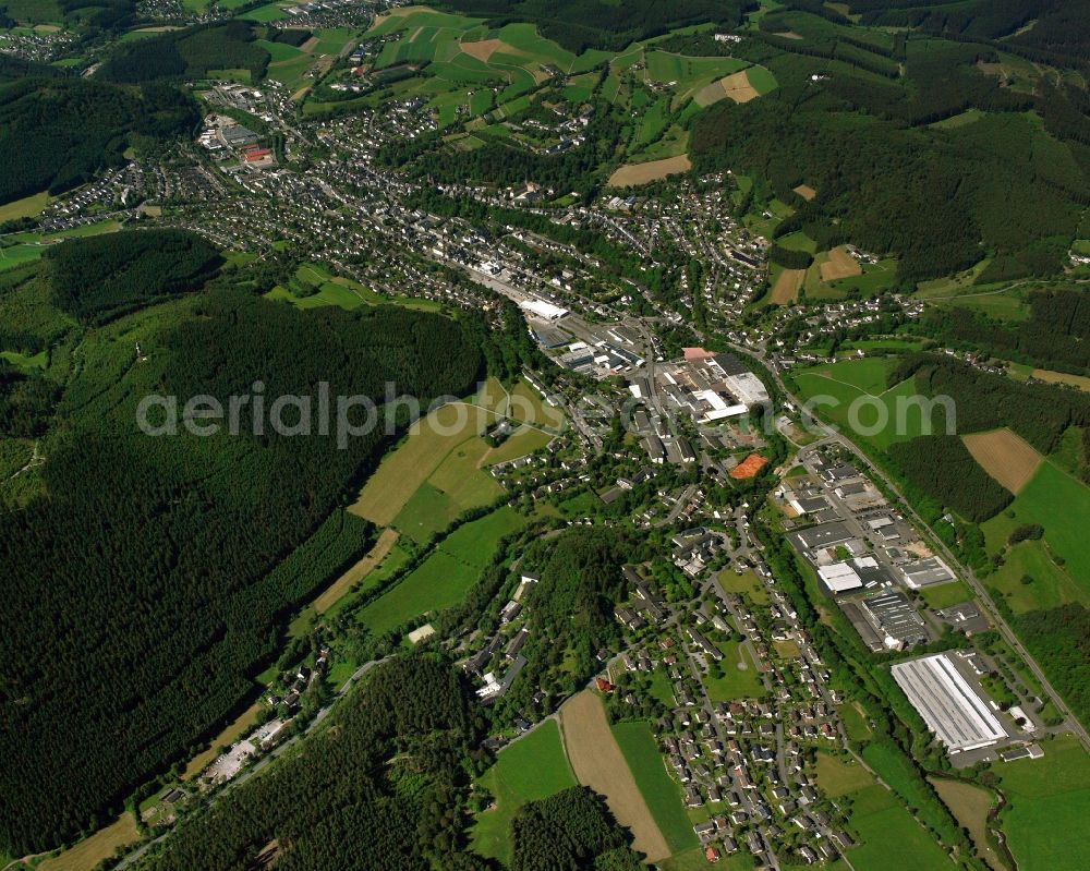 Bad Berleburg from above - Agricultural land and field boundaries surround the settlement area of the village in Bad Berleburg at Siegerland in the state North Rhine-Westphalia, Germany