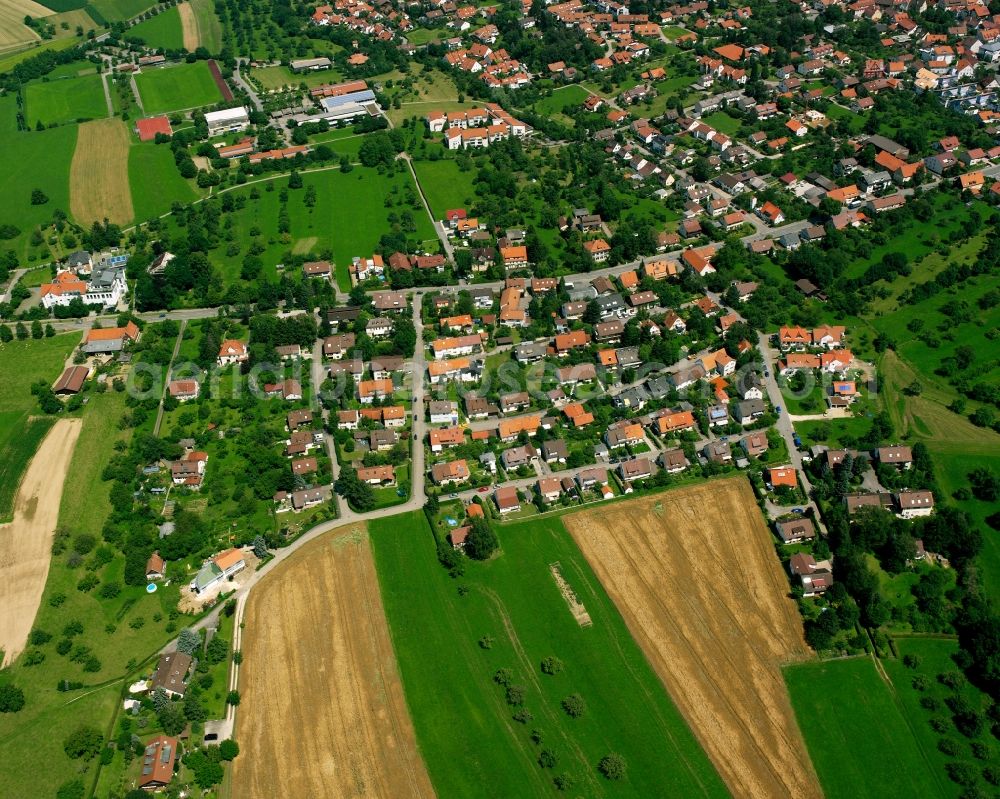 Bad Boll from above - Agricultural land and field boundaries surround the settlement area of the village in Bad Boll in the state Baden-Wuerttemberg, Germany