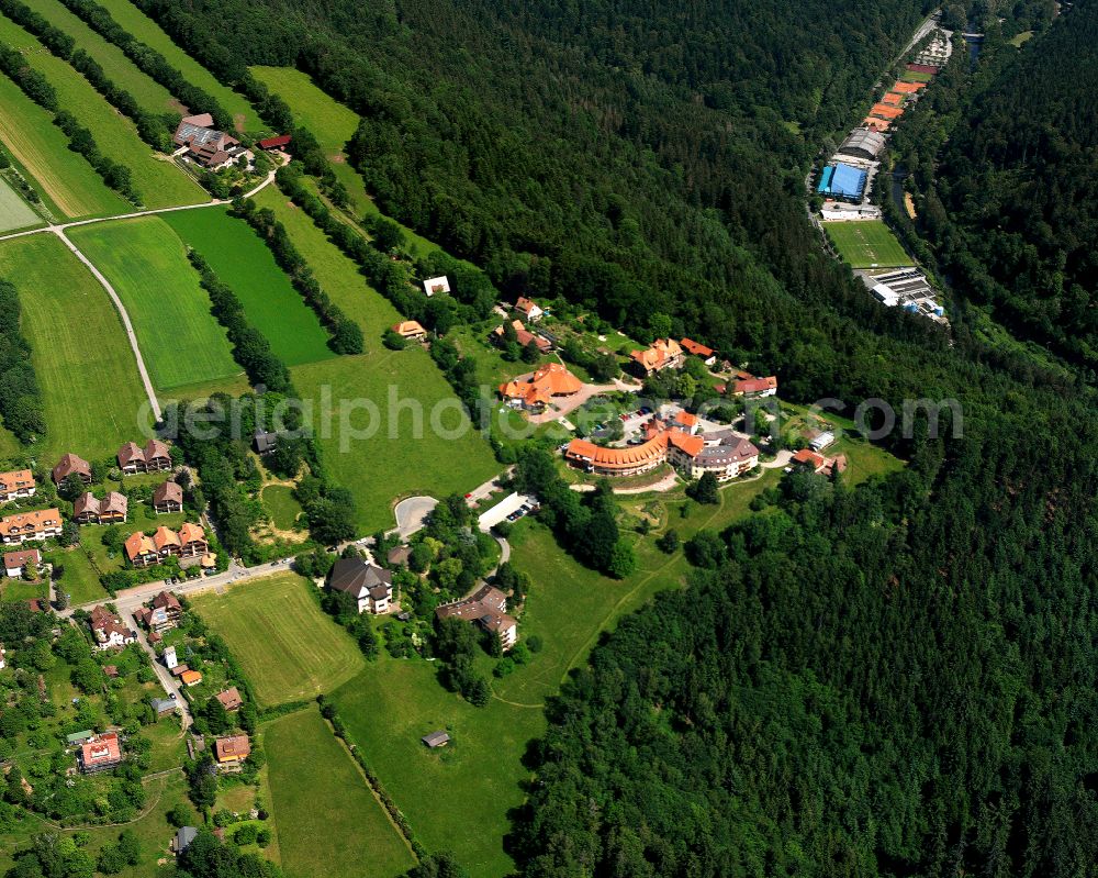 Bad Liebenzell from above - Agricultural land and field boundaries surround the settlement area of the village in Bad Liebenzell in the state Baden-Wuerttemberg, Germany