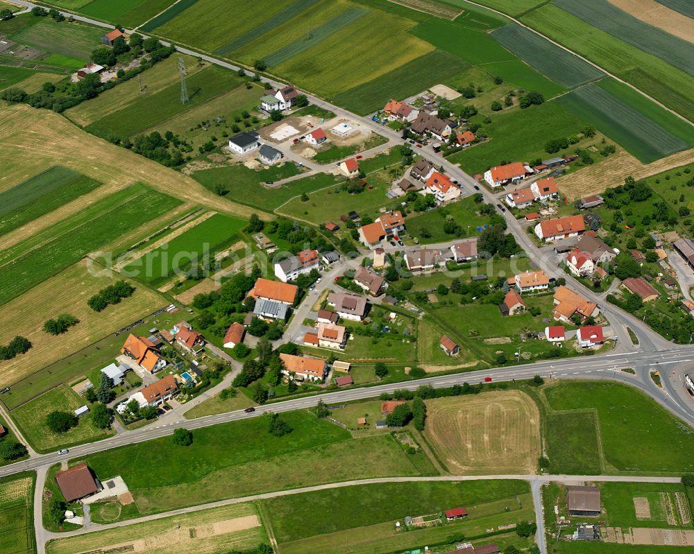 Bad Liebenzell from the bird's eye view: Agricultural land and field boundaries surround the settlement area of the village in Bad Liebenzell in the state Baden-Wuerttemberg, Germany