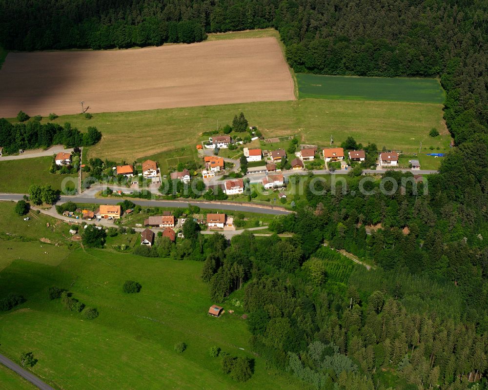 Aerial image Bad Teinach-Zavelstein - Agricultural land and field boundaries surround the settlement area of the village in Bad Teinach-Zavelstein in the state Baden-Wuerttemberg, Germany