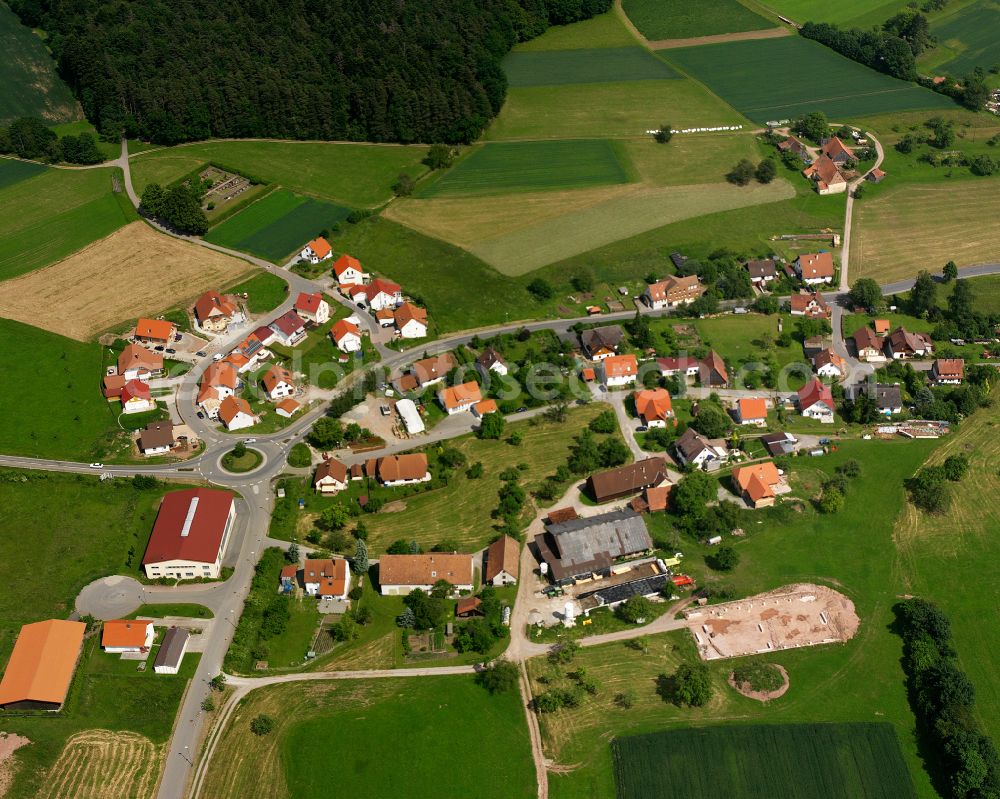 Bad Teinach-Zavelstein from above - Agricultural land and field boundaries surround the settlement area of the village in Bad Teinach-Zavelstein in the state Baden-Wuerttemberg, Germany