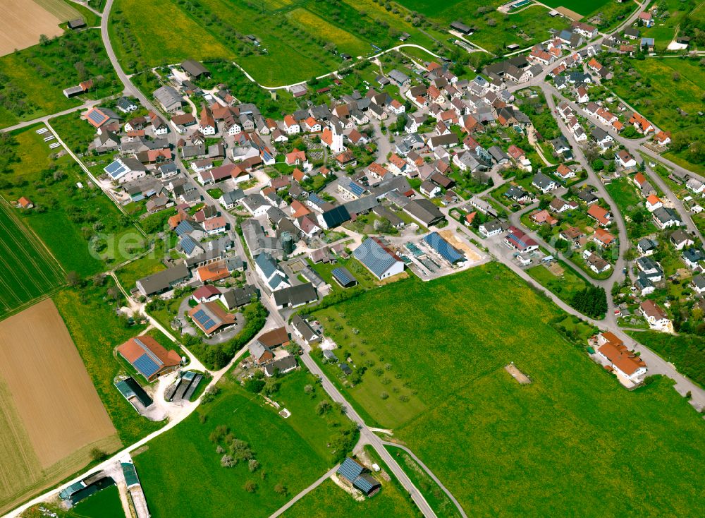 Ballendorf from above - Agricultural land and field boundaries surround the settlement area of the village in Ballendorf in the state Baden-Wuerttemberg, Germany