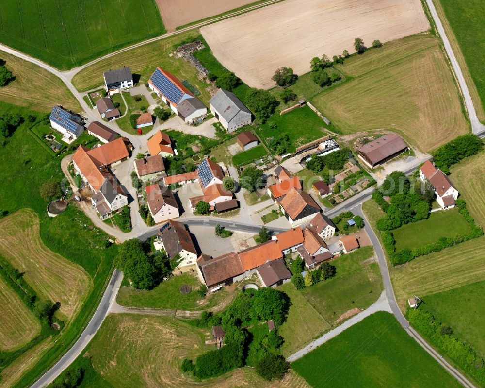 Ballstadt from the bird's eye view: Agricultural land and field boundaries surround the settlement area of the village in Ballstadt in the state Bavaria, Germany