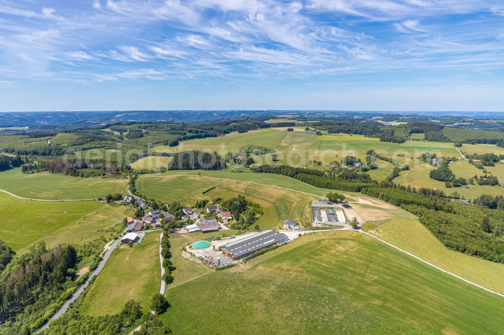 Aerial photograph Balve - Agricultural land and field boundaries surround the settlement area of the village in Balve in the state North Rhine-Westphalia, Germany