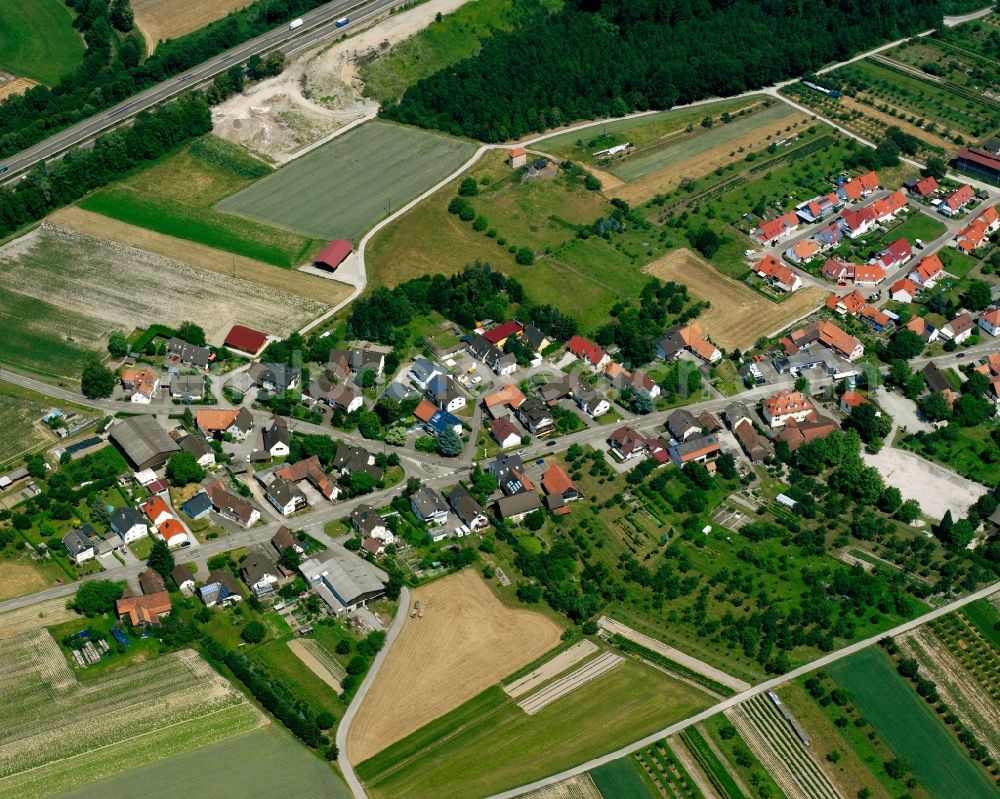 Balzhofen from above - Agricultural land and field boundaries surround the settlement area of the village in Balzhofen in the state Baden-Wuerttemberg, Germany