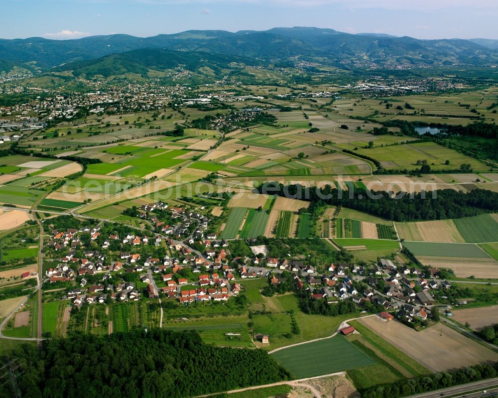 Balzhofen from above - Agricultural land and field boundaries surround the settlement area of the village in Balzhofen in the state Baden-Wuerttemberg, Germany