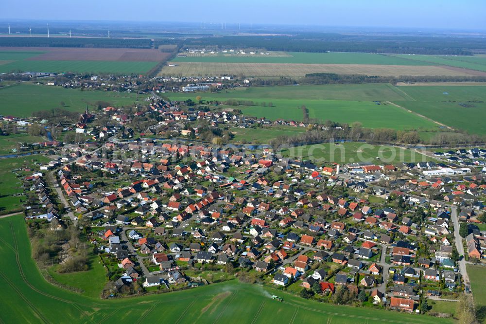 Banzkow from above - Agricultural land and field boundaries surround the settlement area of the village in Banzkow in the state Mecklenburg - Western Pomerania, Germany