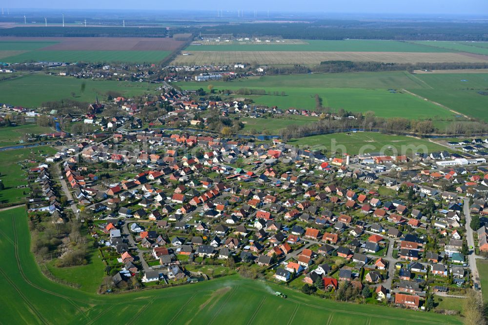 Banzkow from the bird's eye view: Agricultural land and field boundaries surround the settlement area of the village in Banzkow in the state Mecklenburg - Western Pomerania, Germany