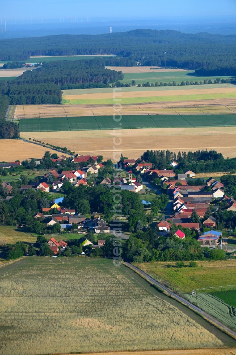 Baruth/Mark from the bird's eye view: Agricultural land and field boundaries surround the settlement area of the village in Baruth/Mark in the state Brandenburg, Germany