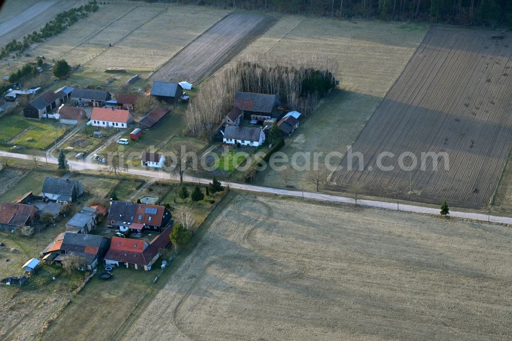 Basdorf from above - Agricultural land and field boundaries surround the settlement area of the village in Basdorf in the state Brandenburg, Germany