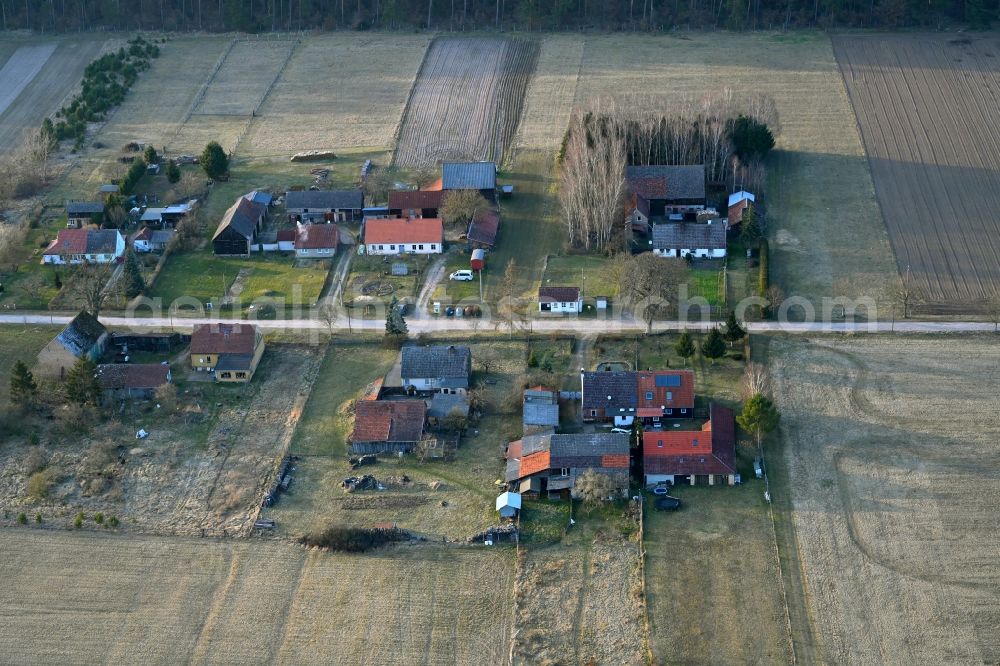 Basdorf from the bird's eye view: Agricultural land and field boundaries surround the settlement area of the village in Basdorf in the state Brandenburg, Germany