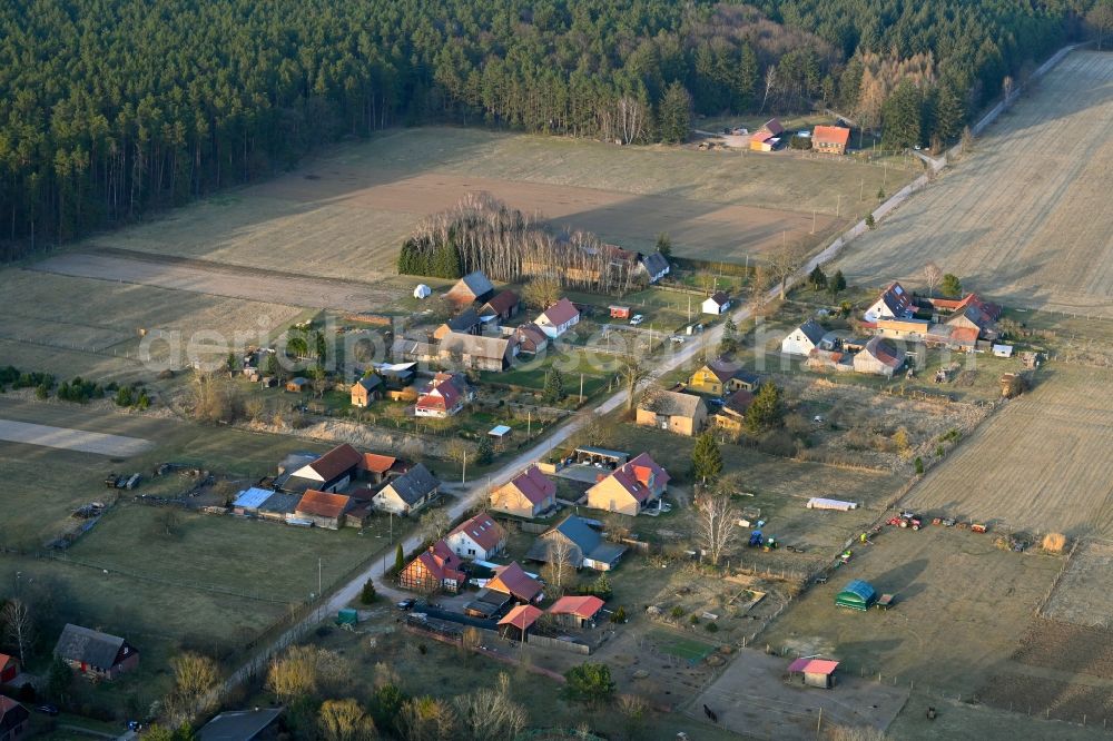 Basdorf from above - Agricultural land and field boundaries surround the settlement area of the village in Basdorf in the state Brandenburg, Germany