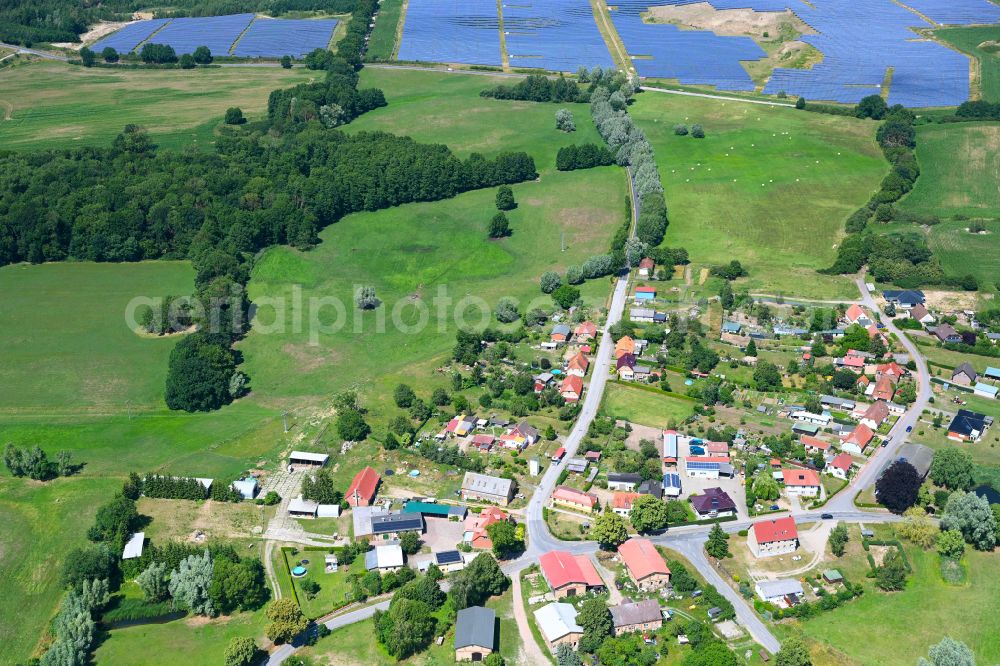 Baumgarten from above - Agricultural land and field boundaries surround the settlement area of the village in Baumgarten in the state Mecklenburg - Western Pomerania, Germany