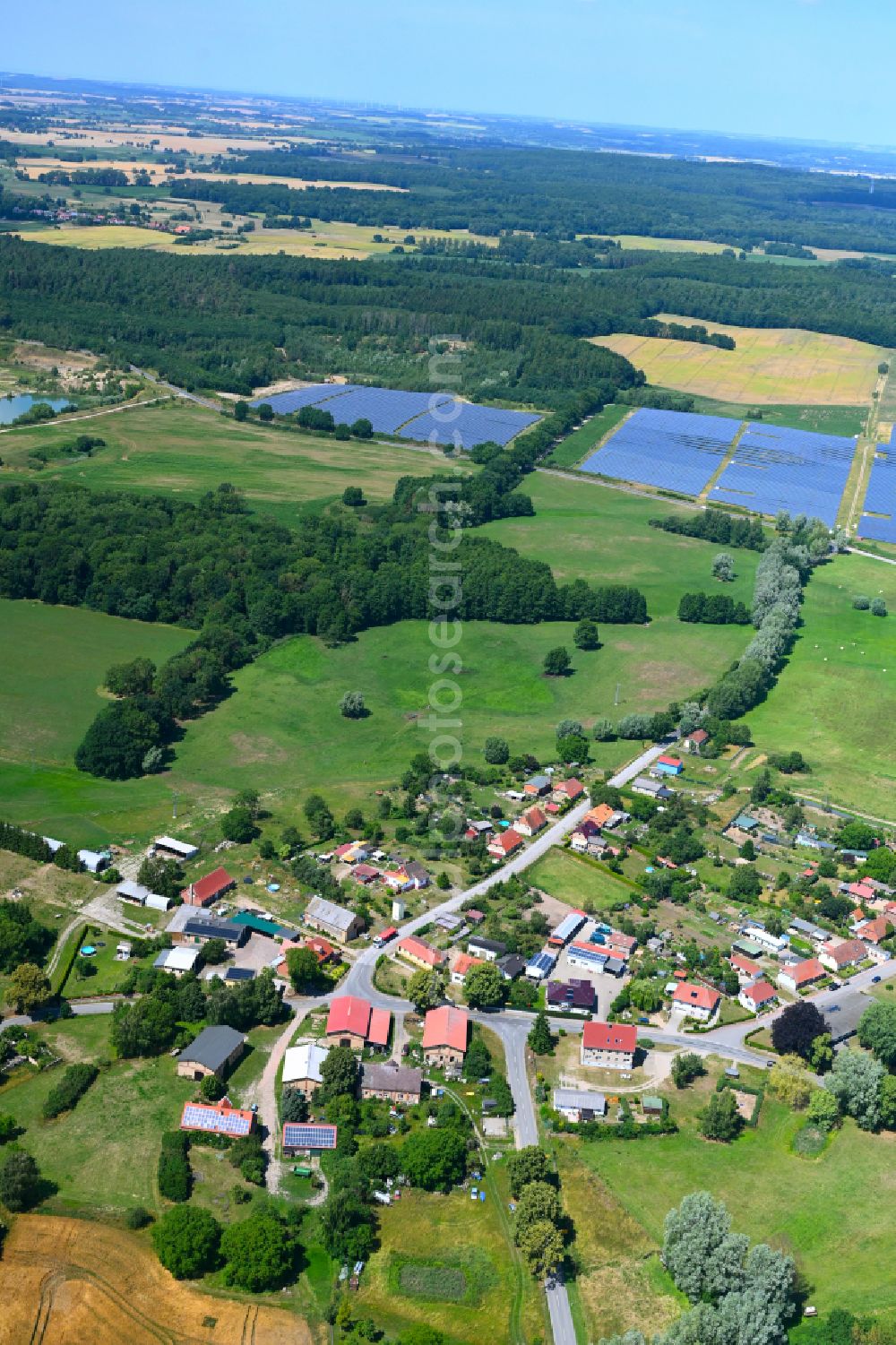 Aerial image Baumgarten - Agricultural land and field boundaries surround the settlement area of the village in Baumgarten in the state Mecklenburg - Western Pomerania, Germany