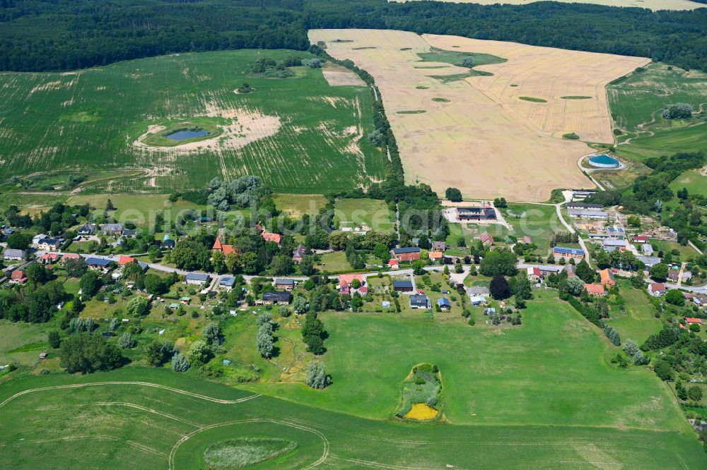 Baumgarten from the bird's eye view: Agricultural land and field boundaries surround the settlement area of the village in Baumgarten in the state Mecklenburg - Western Pomerania, Germany