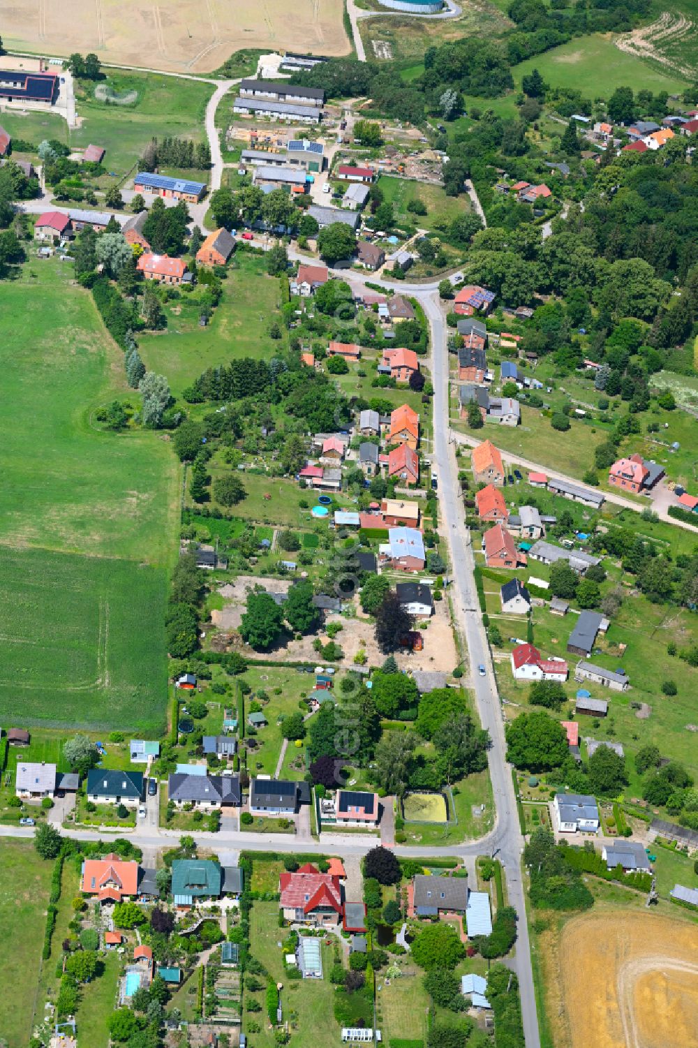 Aerial image Baumgarten - Agricultural land and field boundaries surround the settlement area of the village in Baumgarten in the state Mecklenburg - Western Pomerania, Germany