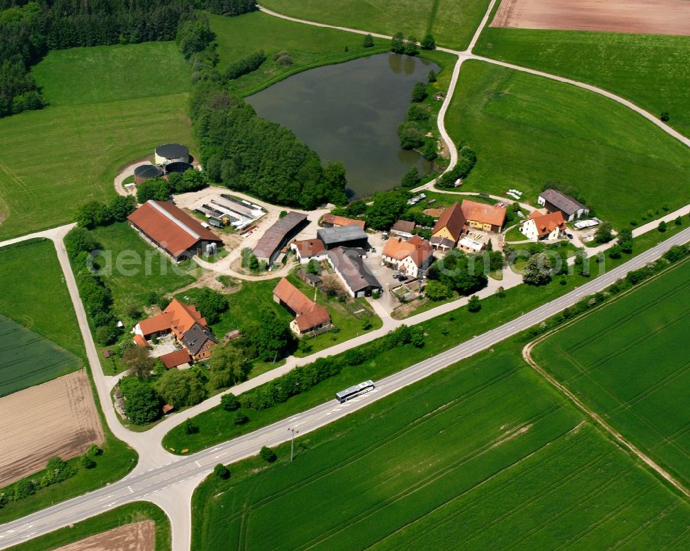 Aerial image Bauzenweiler - Agricultural land and field boundaries surround the settlement area of the village in Bauzenweiler in the state Bavaria, Germany