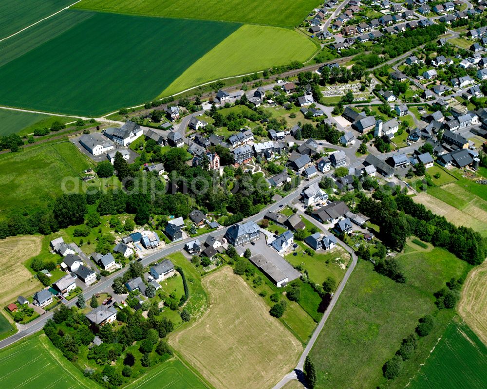 Aerial image Büchenbeuren - Agricultural land and field boundaries surround the settlement area of the village in Büchenbeuren in the state Rhineland-Palatinate, Germany