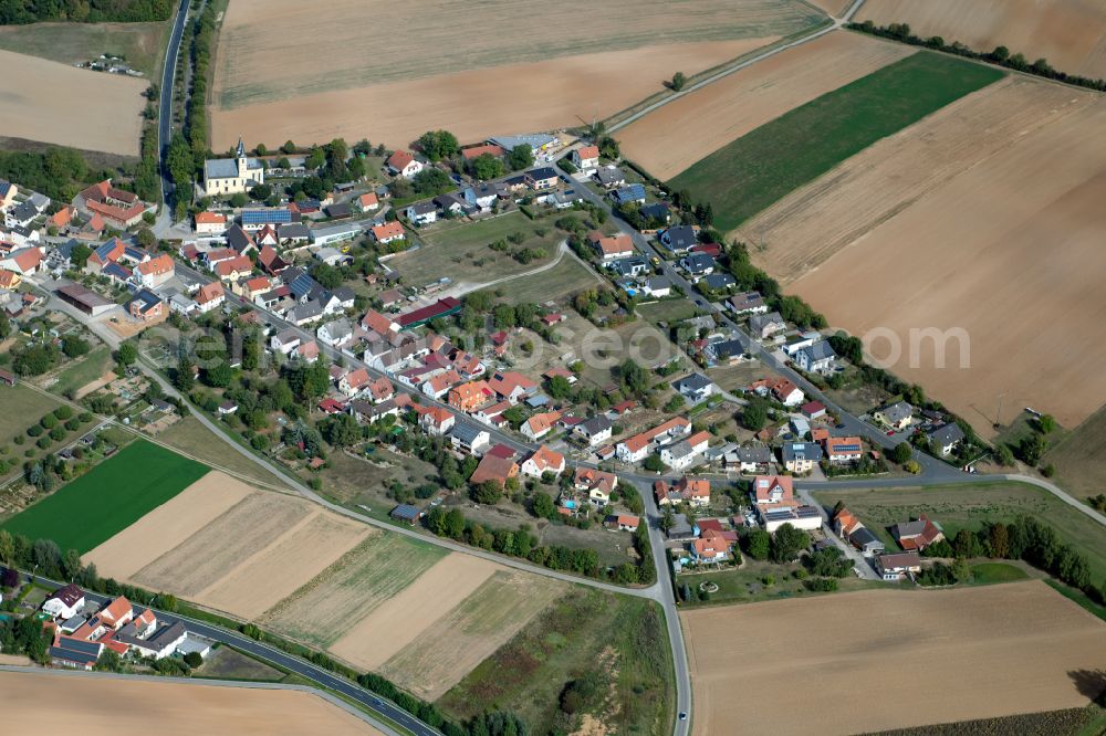 Aerial photograph Büchold - Agricultural land and field boundaries surround the settlement area of the village in Büchold in the state Bavaria, Germany