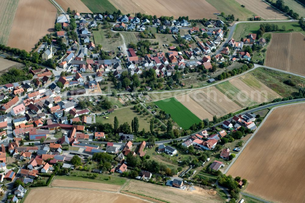 Büchold from the bird's eye view: Agricultural land and field boundaries surround the settlement area of the village in Büchold in the state Bavaria, Germany