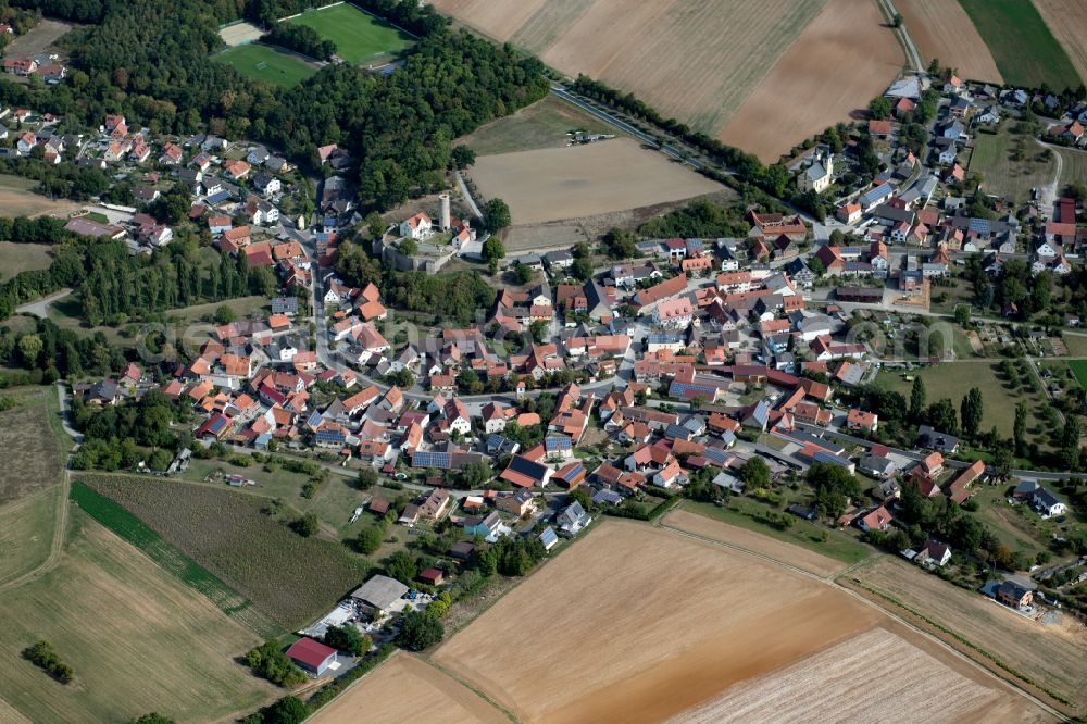 Aerial image Büchold - Agricultural land and field boundaries surround the settlement area of the village in Büchold in the state Bavaria, Germany