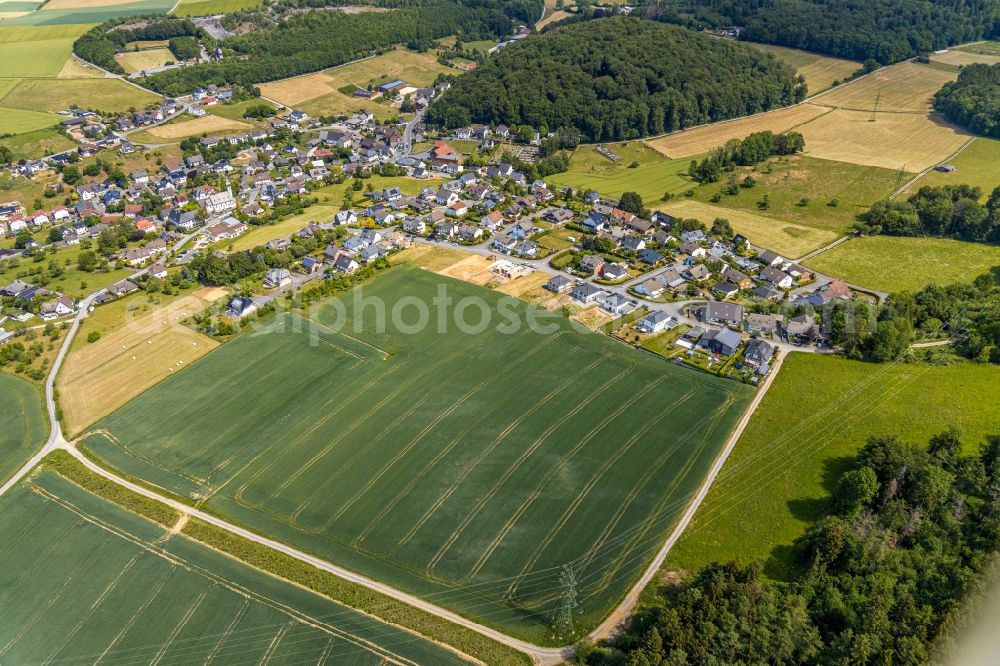 Aerial photograph Beckum - Agricultural land and field boundaries surround the settlement area of the village in Beckum in the state North Rhine-Westphalia, Germany