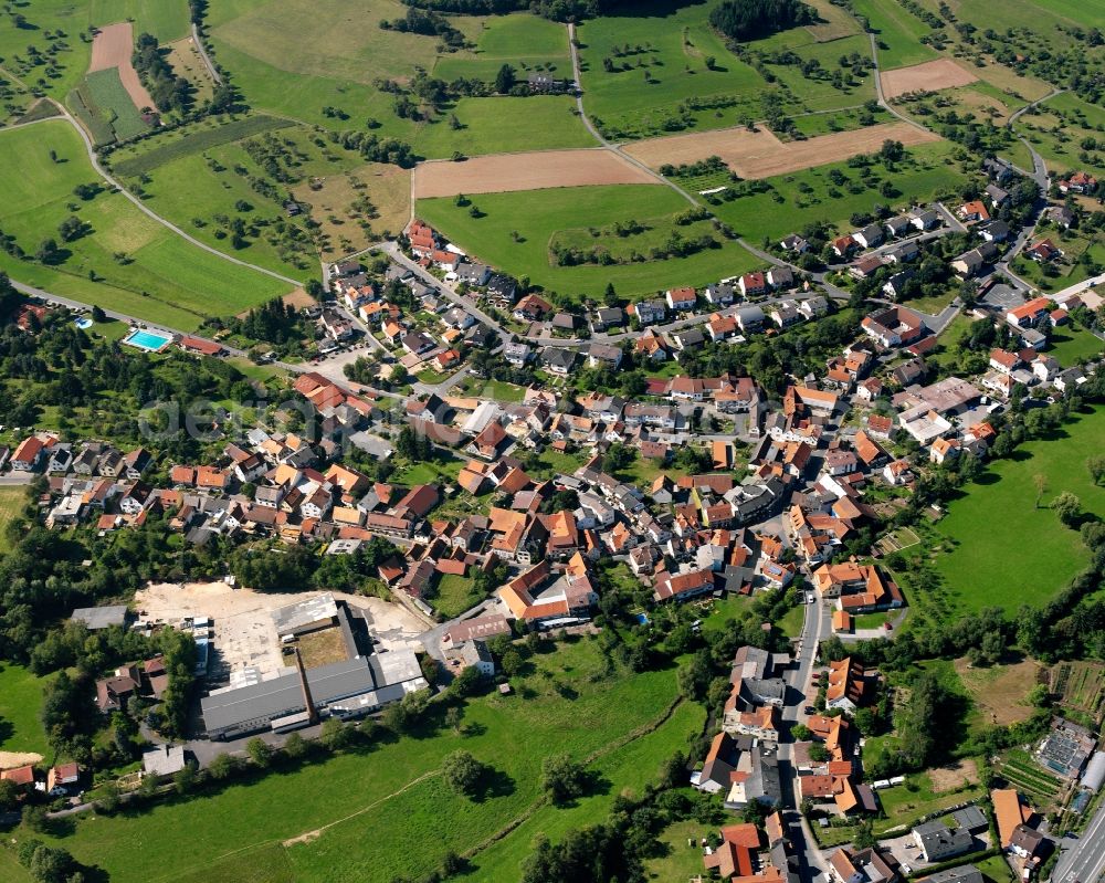 Beerfurth from the bird's eye view: Agricultural land and field boundaries surround the settlement area of the village in Beerfurth in the state Hesse, Germany