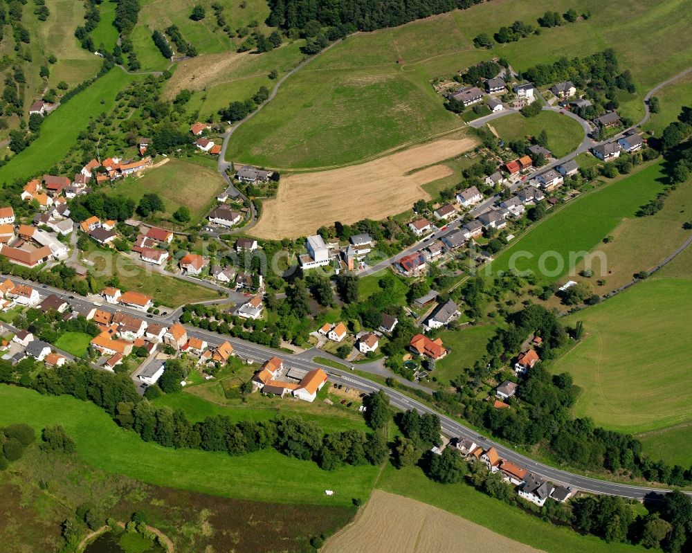 Aerial photograph Beerfurth - Agricultural land and field boundaries surround the settlement area of the village in Beerfurth in the state Hesse, Germany