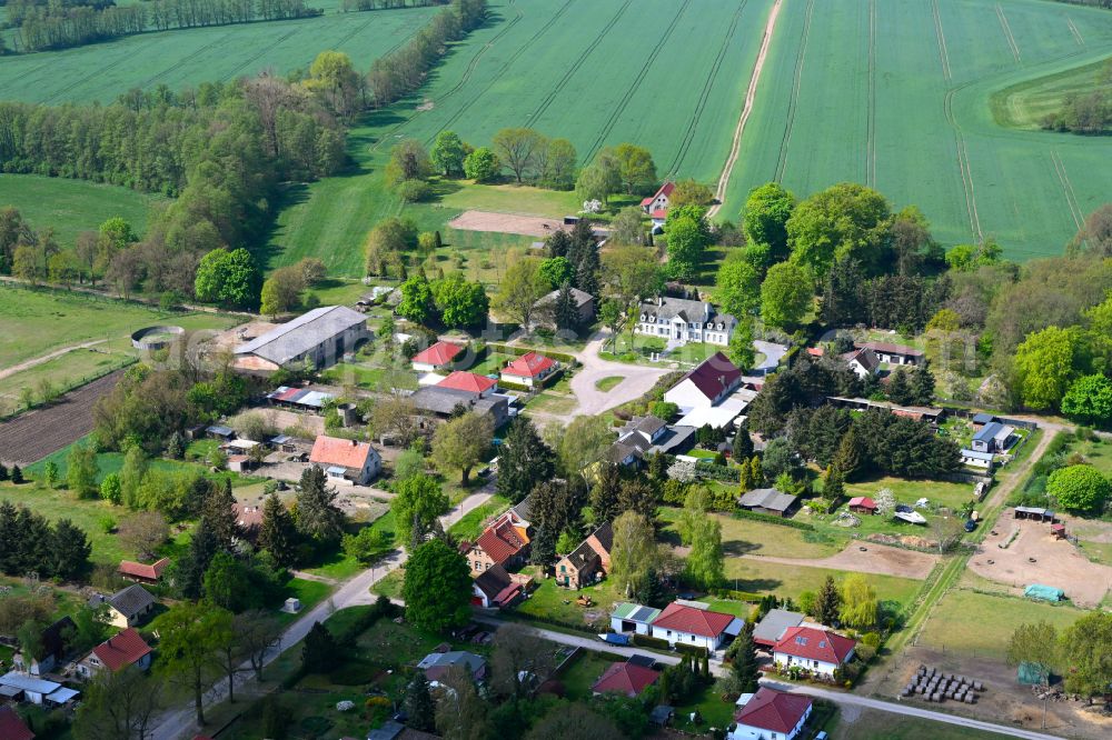 Aerial image Beetz - Agricultural land and field boundaries surround the settlement area of the village in Beetz in the state Brandenburg, Germany